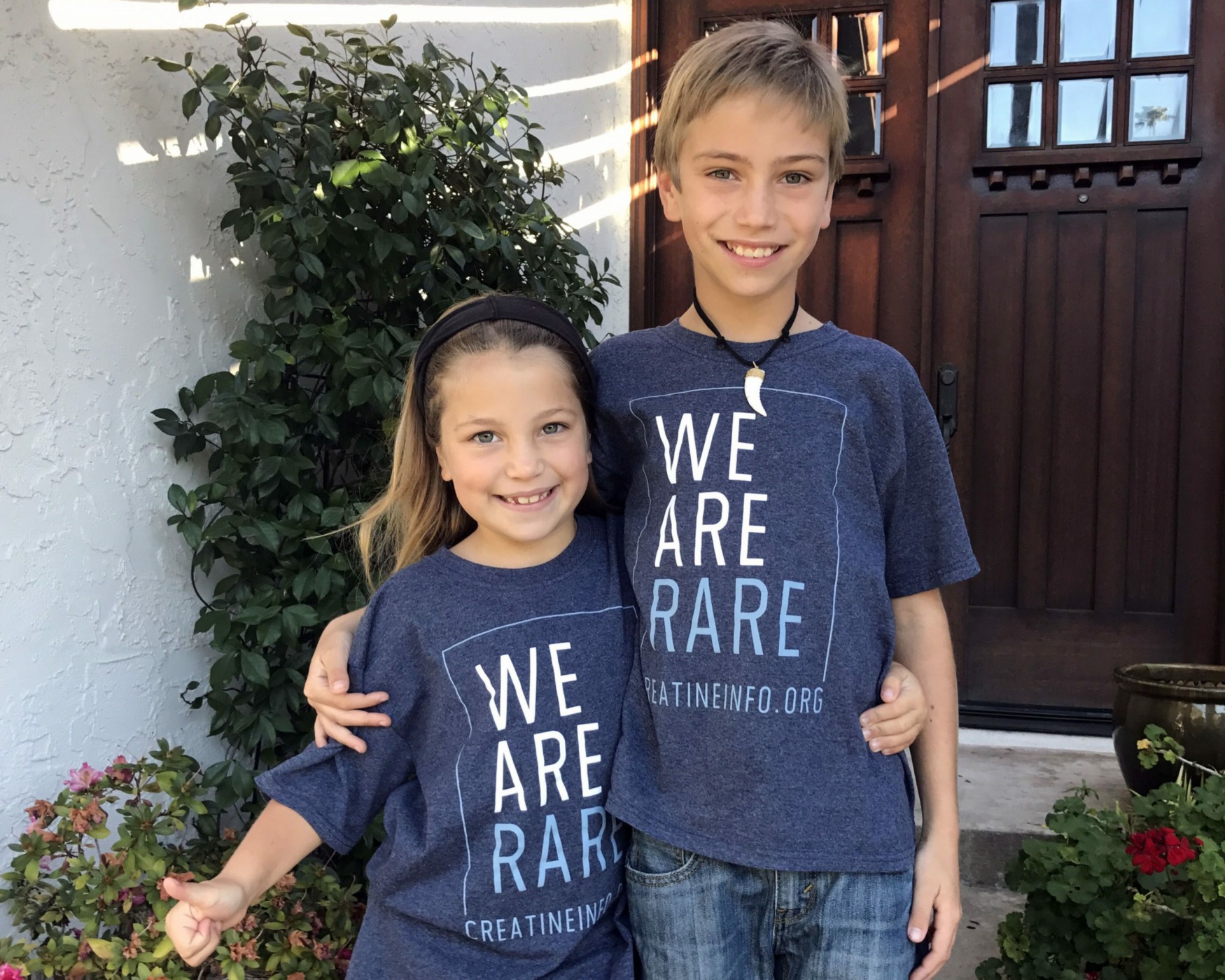 Ty and Paige wearing We are Rare t-shirts for CCDS day.