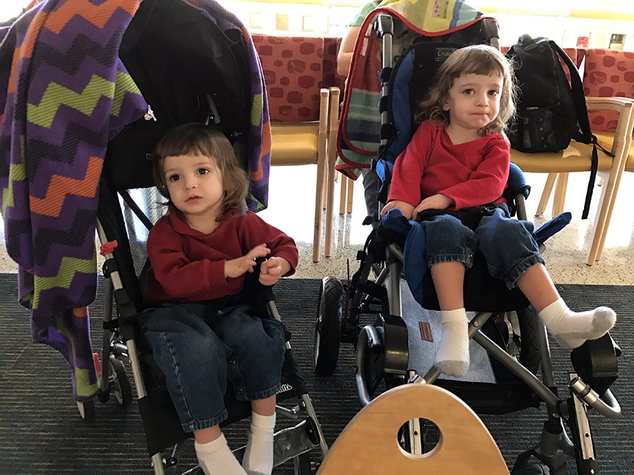 Sitting in strollers in waiting room