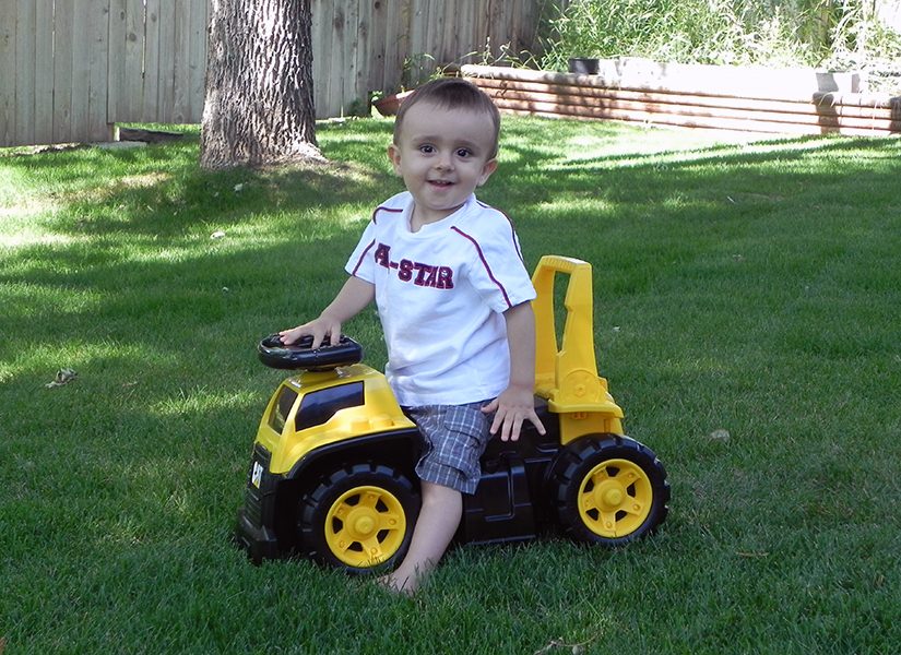 Young Levi on a scoot along toy