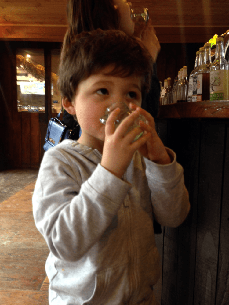 Isaac drinking from a glass