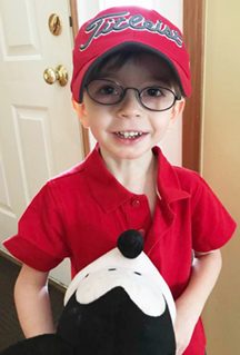 Ben holding mickey mouse stuffed animal