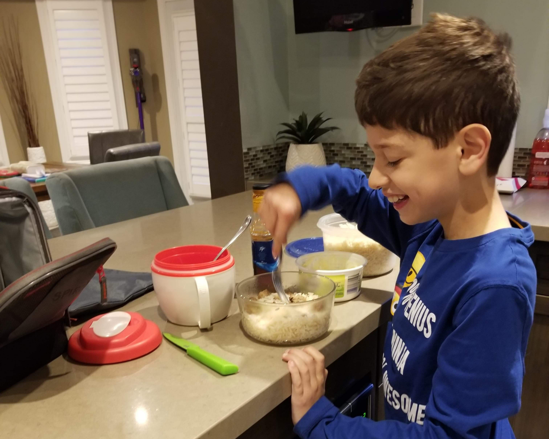 Boy stirring his own food.
