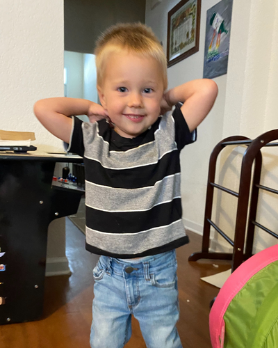 Little boy smiling to the camera.