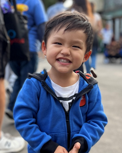 Little boy smiling to the camera.