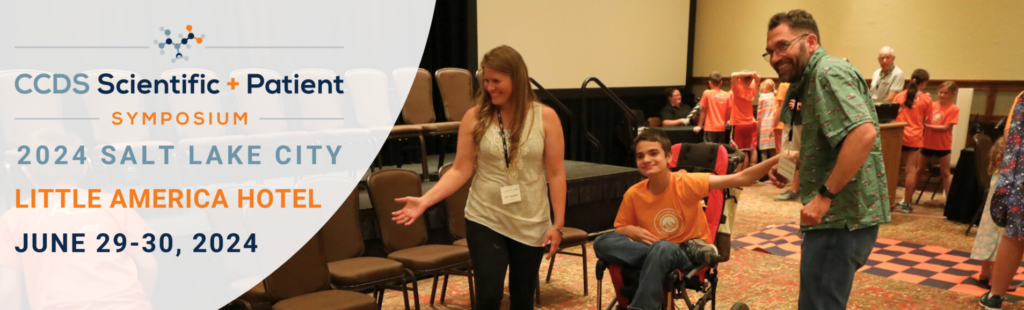 CCDS patient laughing with researchers, CCDS symposium logo next to photo.