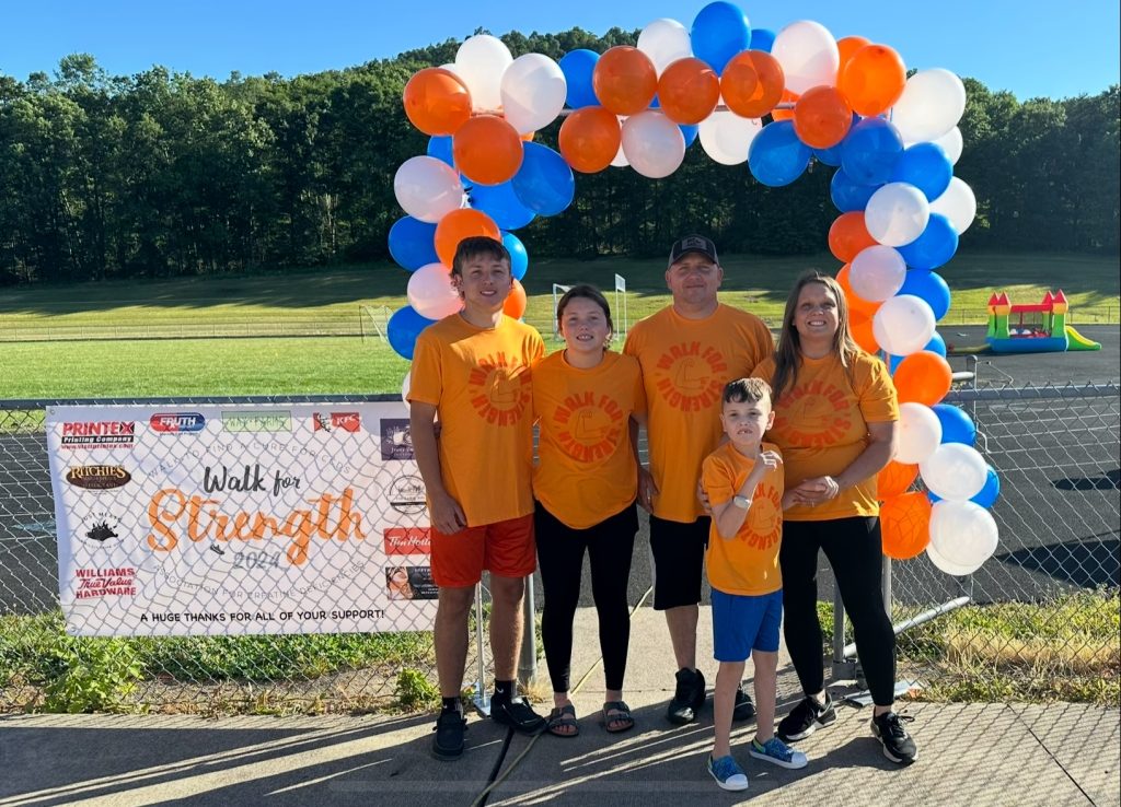 A family at the Walk for Strength