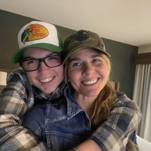 Image of mother and son hugging.