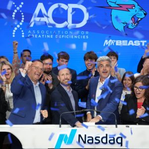 ACD family members and board members cheering with confetti as Randy rings the closing bell for NASDAQ