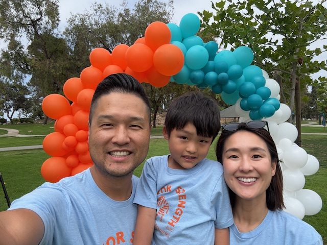 Asher and his parents at the Walk for Strength 2025